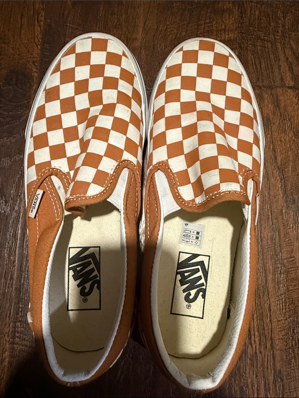 Vans womens Slip-On Sneakers in Orange and White Checkerboard. Womens 8